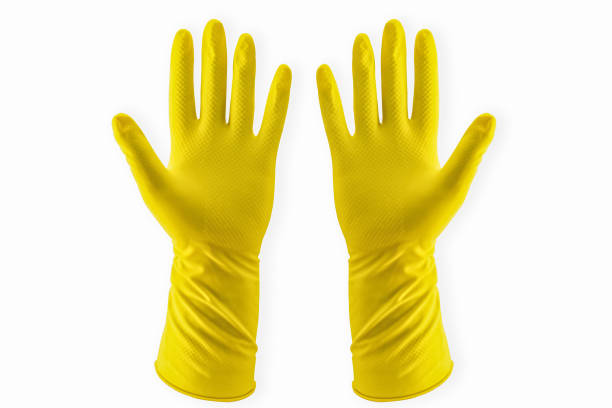 Yellow Household Rubber Glove pair for cleaning disposable stock photo