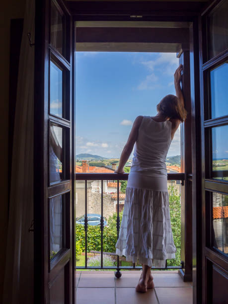 istock Relaxed woman at home window 1178836345