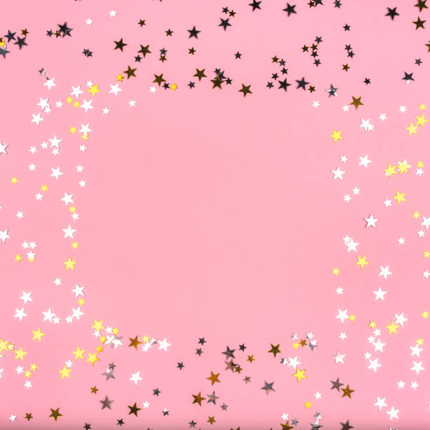 istock Golden and silver stars on pink pastel background. 1178837473