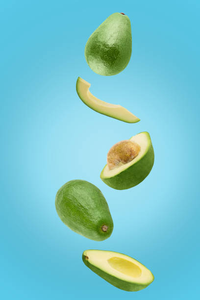 istock Avocado sliced isolated in blue background viewed from above 1178838603
