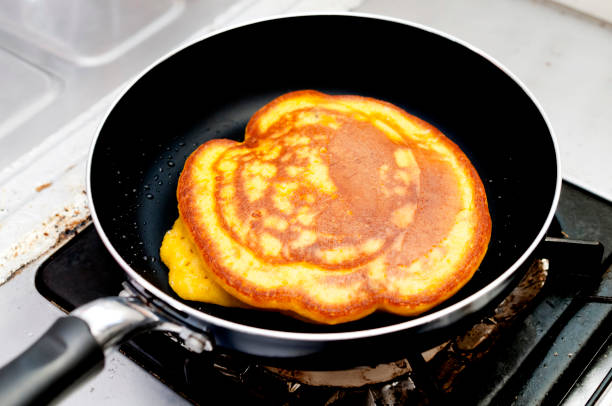 istock Baking pumpkin pancakes in kitchen. Steps of making cooking pancake 1178841585