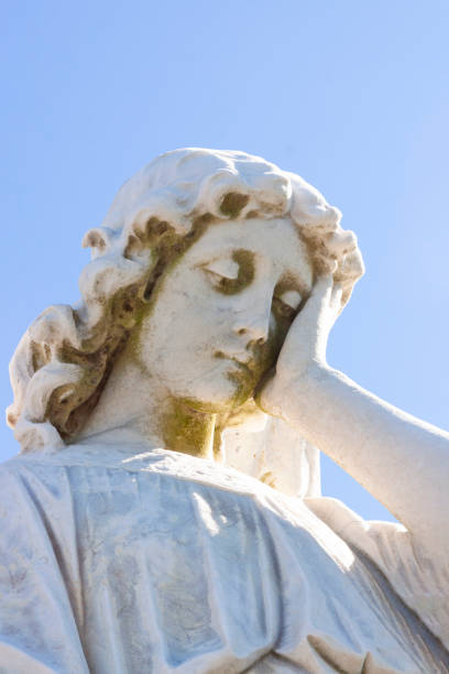 istock Old statue of angle , blue background with copy space 1178842711