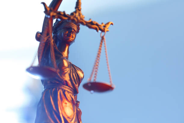 istock Lady Justice In Front Of Blue Background 1178849359