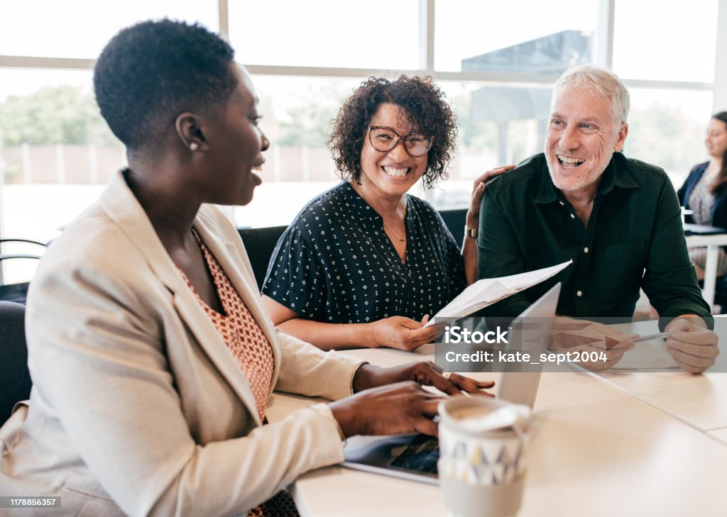 Financial planning for early retirement Business team in the office Multiracial Group Stock Photo
