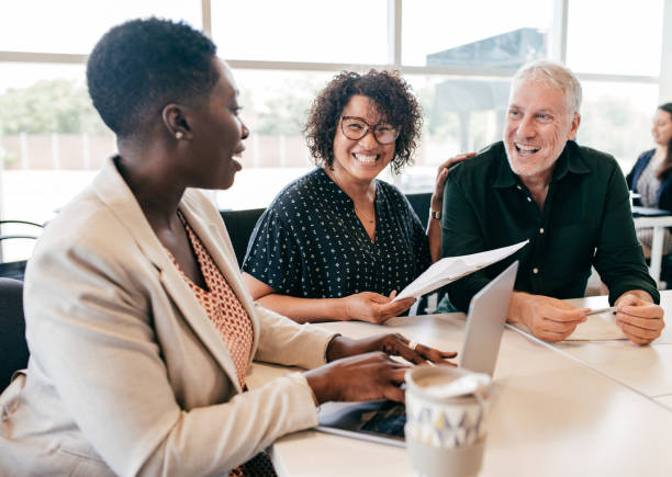 Financial planning for early retirement Business team in the office african american business couple stock pictures, royalty-free photos & images