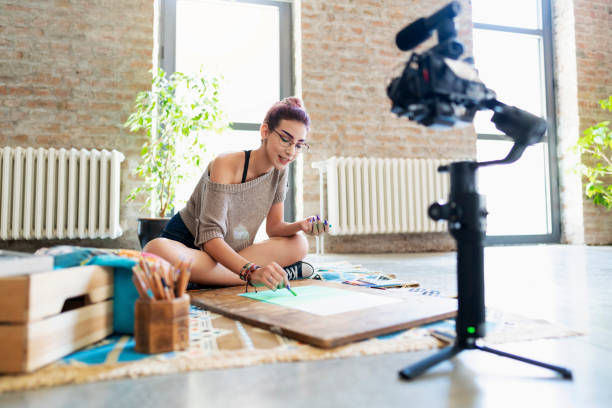 istock Shooting art videos for her vlog 1178857860