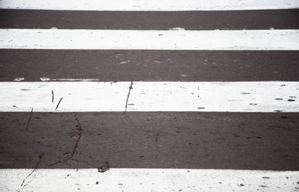 crosswalk on the road for safety when people walking cross the street, Pedestrian crossing on a repaired asphalt road, Crosswalk on the street for safety, logistic import export paso de peatones en la carretera por seguridad cuando la gente que camina cruzan la calle, paso de peatones en una carretera de asfalto reparado, cruce de peatones en la calle para la seguridad, importación logística de exportación y la industria del tr