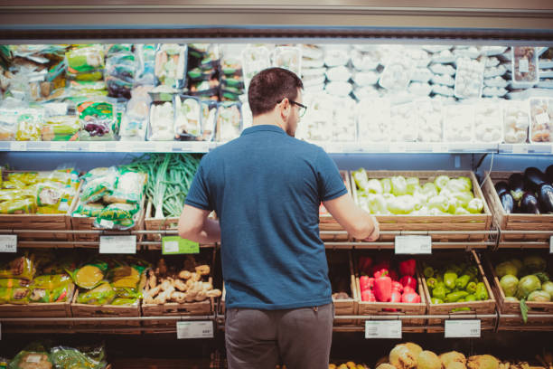 istock Middle age man buying vegetables at the market 1178859977