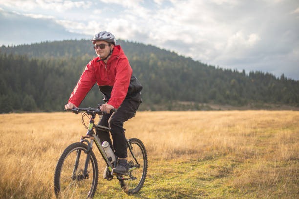 istock Man enjoying an off-road bicycle tour 1178864735