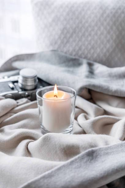 istock Burning candle on a windowsill in the rain. 1178869915
