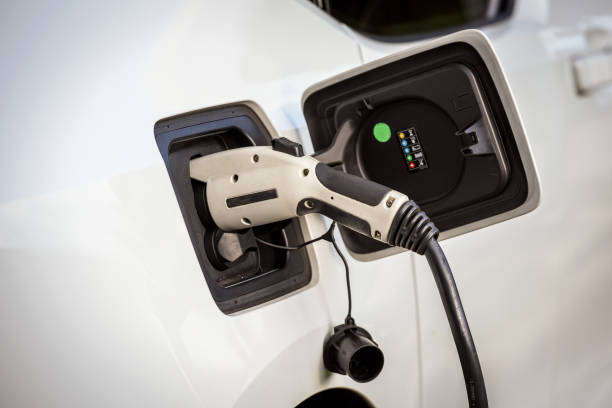 Electric car charging - electric mobility - automotive industry stock photo