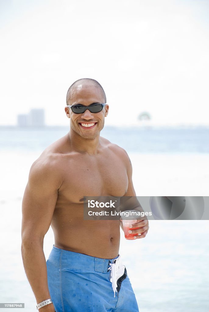 Posing on the beach Man posing on the beach. Focus is on the chest. Adult Stock Photo