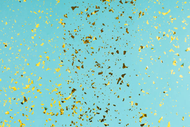 istock Golden sparkles on turquoise background. 1178880449