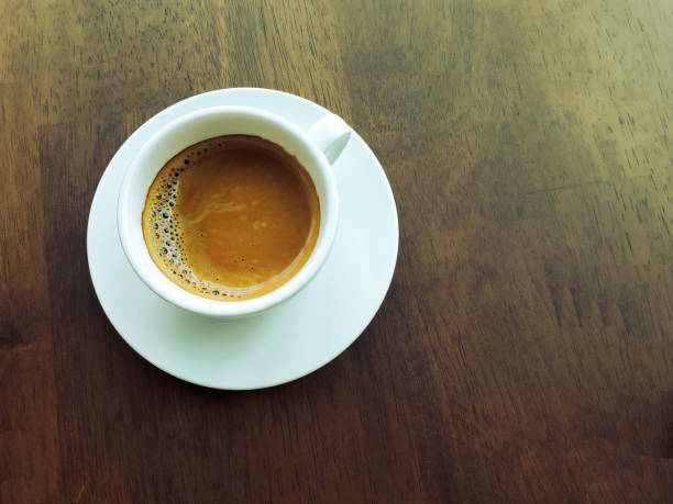 istock Espresso Coffee  in white cup on wooden table 1178880453