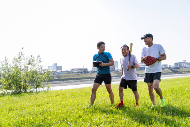 Smilng woman and boot camp fitness group with medicine ball