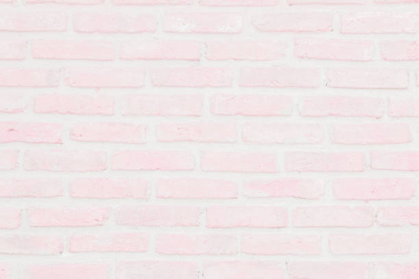 istock Abstract Pastel Pink and White brick wall texture background pre wedding. Brickwork or stonework lovely flooring interior rock old pattern clean concrete grid uneven bricks. 1178881561