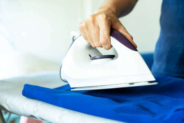 istock Hand of a woman is ironing. 1178888253