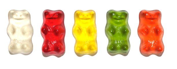 istock Colored Gummy Bears in Row Isolated White 117888844