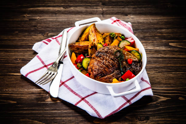 istock Grilled steak with sunny side up egg, fried potatoes and vegetable salad 1178889058