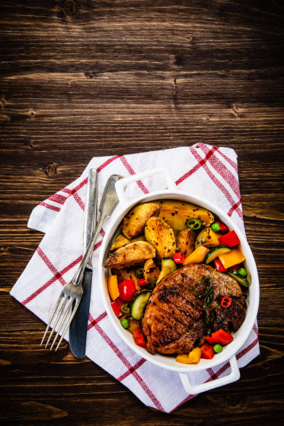 istock Grilled steak with sunny side up egg, fried potatoes and vegetable salad 1178889109
