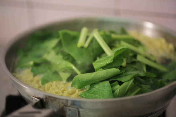 istock Cooking instant noodles with fresh green Vegetable. 1178891113