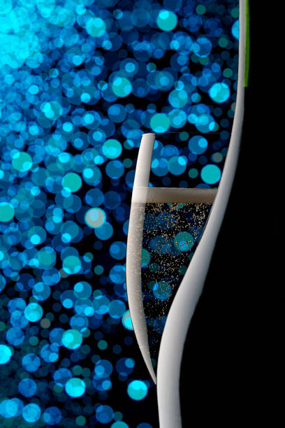 Blue powder in a glass isolated on a black background.
