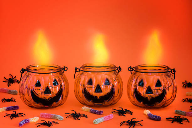 istock Halloween pumpkin,jack o lantern, luminous isolated on bright orange background. Halloween holiday party. 1178900897