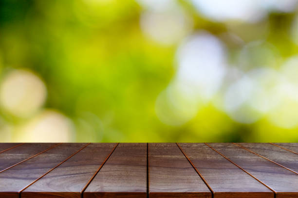 istock Wooden table on natural background for product display montage 1178901581