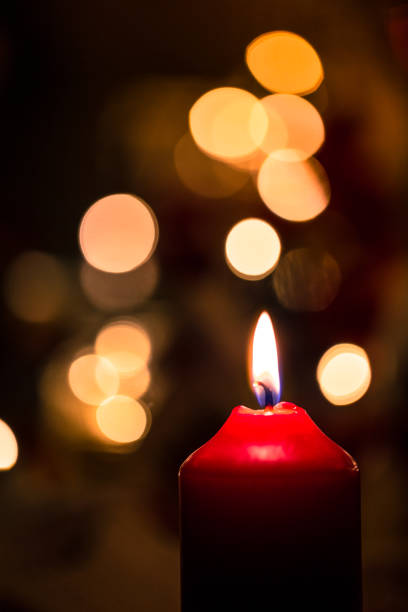 istock Red Christmas candle with glowing Festive Lights 1178906707