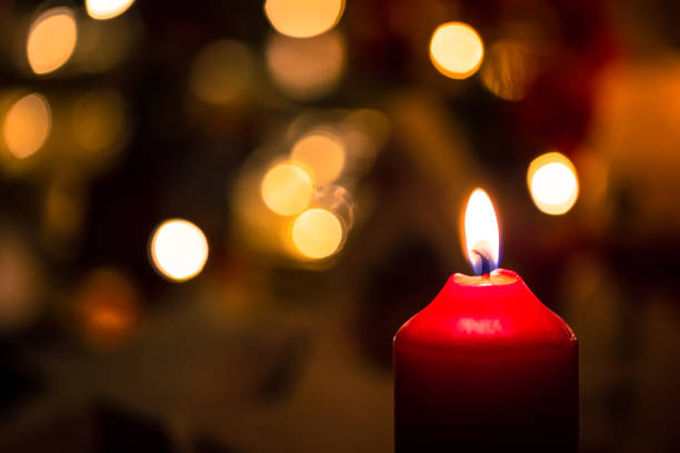 istock Red Christmas candle with glowing Festive Lights 1178906716