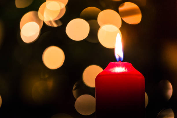 istock Red Christmas candle with glowing Festive Lights 1178906717