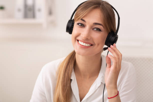 istock Smiling Woman In Headset Working In Call Center Office 1178906914