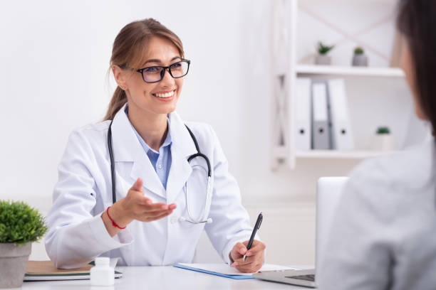 istock Lady Doctor Talking With Unrecognizable Patient During Appointment In Office 1178907966