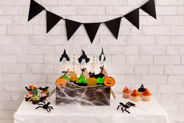 istock Witches green drinks in glass bottles inside box covered with web 1178907999