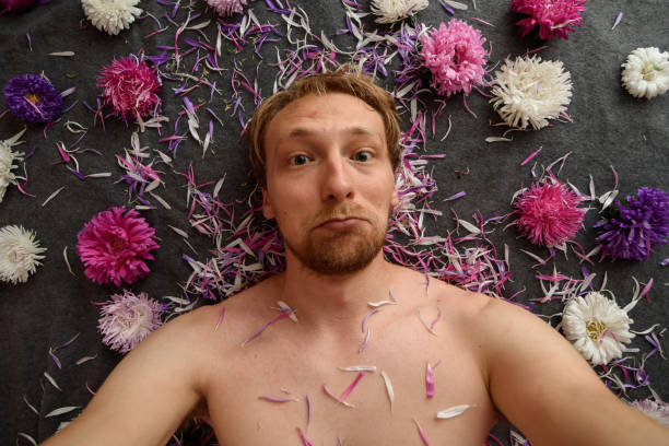 istock Guy takes selfie in flowers 1178908588