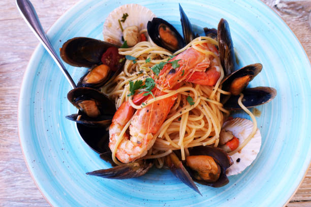 istock seafood pasta at a restaurant on a rustic table 1178909635