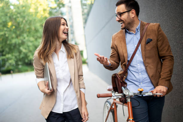 istock Business people discussing and smiling while walking together outdoor 1178909674