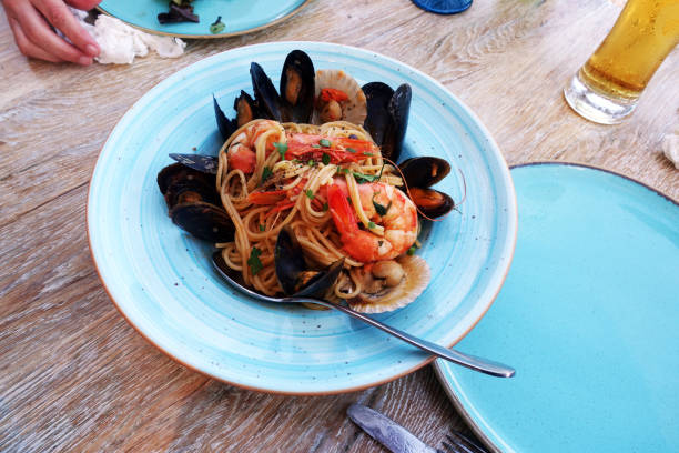 istock seafood pasta at a restaurant on a rustic table 1178909808
