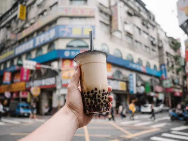 Various shots of famous Taipei street food and drinks: dim sum, taiwanese pepper bun (Hujiao bing), bubble milk teas and pies. Shot in Wanhua, Ximen, Daan district.