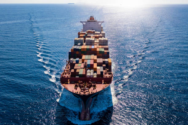istock Aerial front view of a container cargo ship on open sea 1178912448
