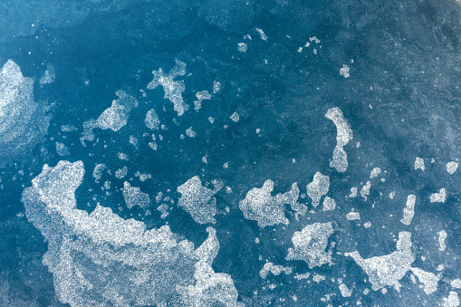 Aerial view on the frozen surface of a lake.