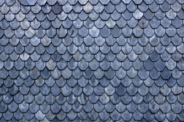 istock Aged slate roof tiles close-up 1178916187