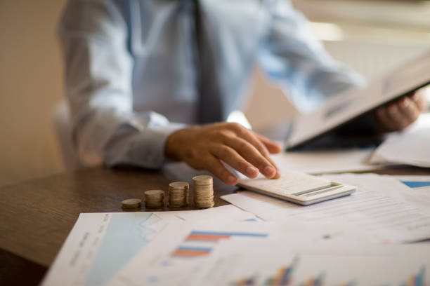istock Business accounting concept, Business man using calculator with computer laptop, budget and loan paper in office. 1178916837