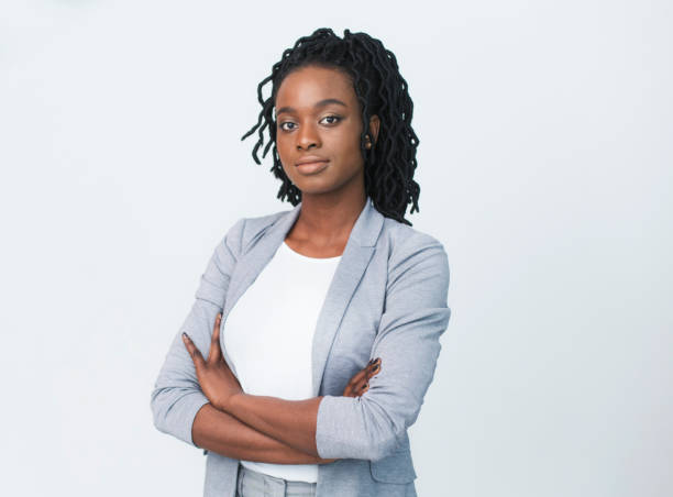istock Serious Business Girl Looking At Camera Crossing Hands, Studio Shot 1178917632