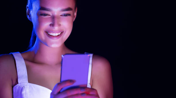 istock Woman texting on phone, face illuminated by screen light 1178917665