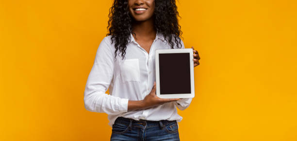 istock African woman showing blank digital tablet screen 1178917723