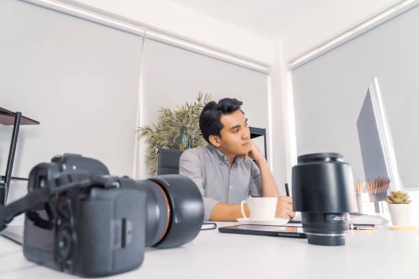 istock Young photographers looking at photographs on computer 1178918124