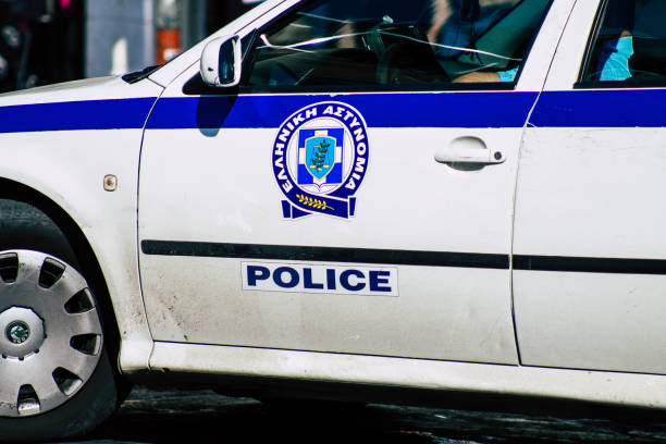 Colors of Greece Athens Greece September 12, 2019 View of a Greek police car driving through the streets of Athens in the evening attica stock pictures, royalty-free photos & images