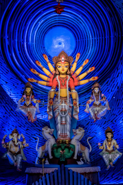 goddess durga idol at decorated durga puja pandal, shot at colored light, at kolkata, west bengal, india. durga puja is biggest religious festival of hinduism and is now celebrated worldwide. - west indian culture imagens e fotografias de stock