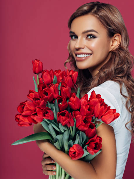 istock Beautiful woman with tulips 1178919530